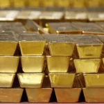 Gold bars and map of Ghana illustrating record 2025 output