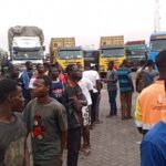 Stranded transit trucks at Paga Border awaiting entry to Burkina Faso